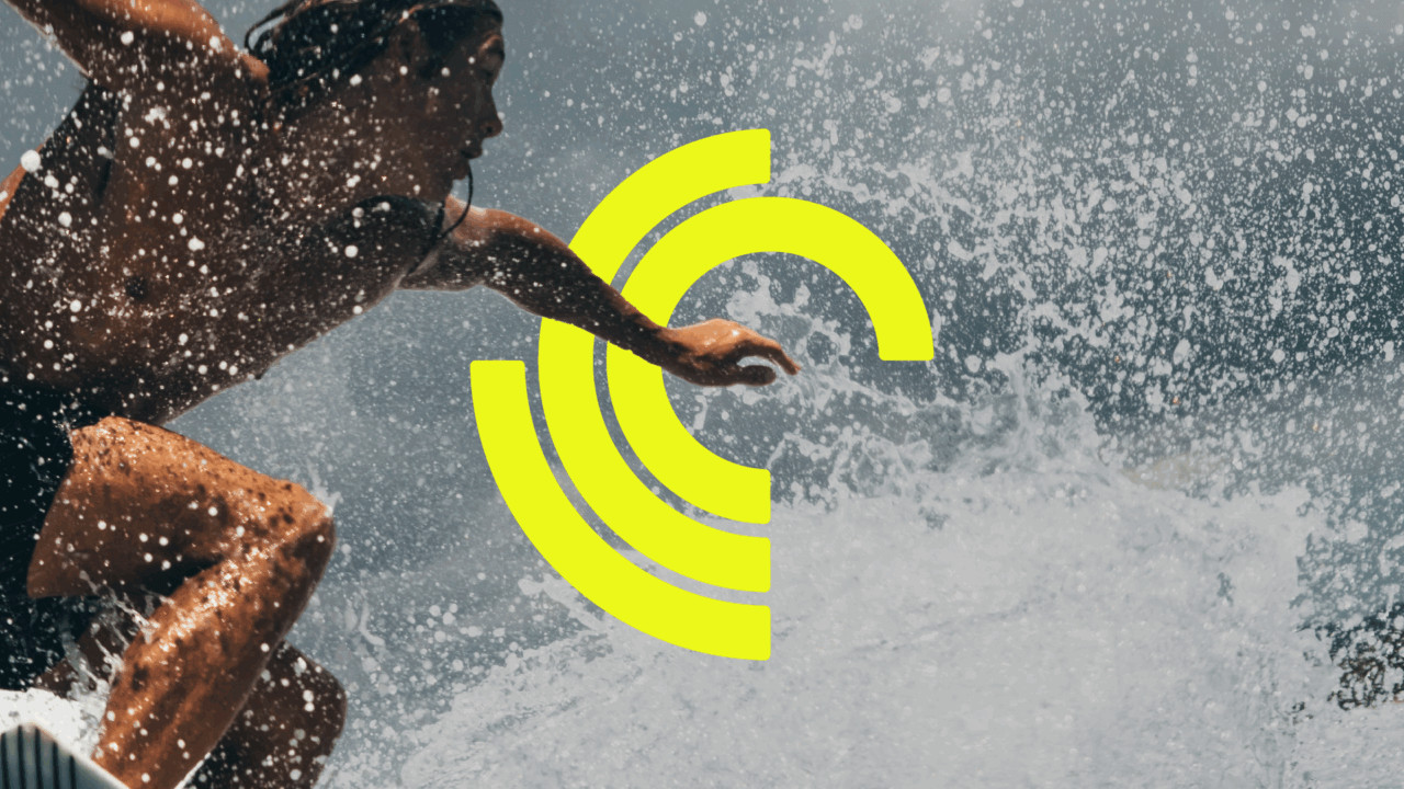 Crest Experiences Logo with a man surfing